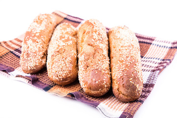 Freshly baked bread rolls with sesame