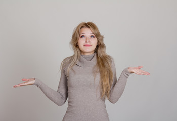 Businesswoman in gesture of asking and confusion