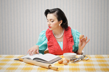 Girl reads a cookbook