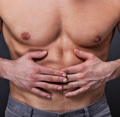 Naklejka premium Trainierter Bauch hat Schmerzen