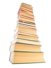 Distorted image of old books tower isolated on white