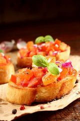 Colourful bruschetta on toasted baguette