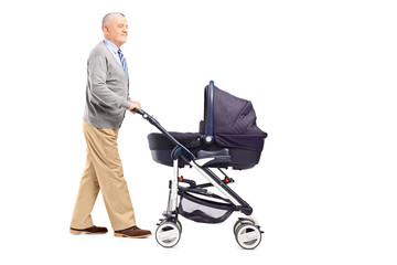 Full length portrait of a grandfather pushing his baby nephew in