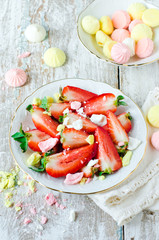 Fresh strawberries with pieces of meringue