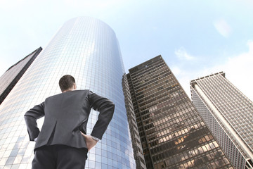 man looking on skyscraper