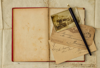 Background with vintage photograph and empty open book