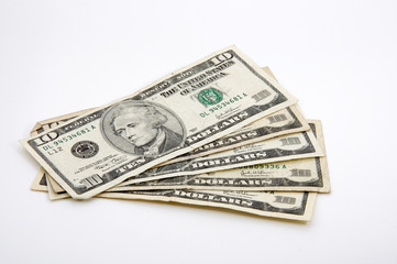 ten-dollar bills spread out on white