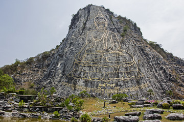 Buddha image carving on rock mountain