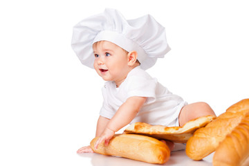 Little boy in a cap and with bread