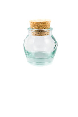 Cork stopper and small glass bottle with white background