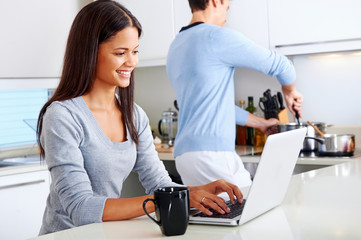 laptop kitchen couple