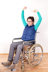 Woman in wheelchair with stretching exercises