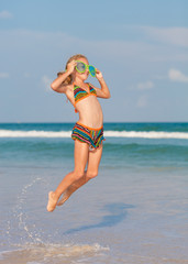 flying jump beach girl on blue sea shore in summer vacation