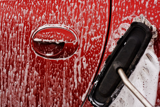 Cleaning the car at jetwash