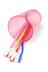 Colorful Toothbrushes In Plastic Cup