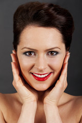 Fototapeta premium Woman with hands near her face