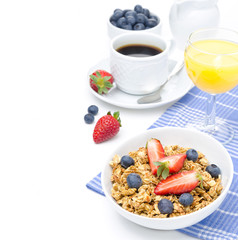 breakfast with homemade granola and fresh berries, orange juice