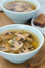 mushroom soup in blue bowl, closeup