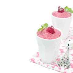 Raspberry mousse decorated with mint isolated
