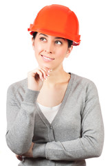 Young woman with orange hard hat on white