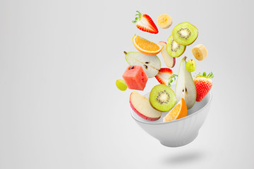 Light salad with flying fresh fruits