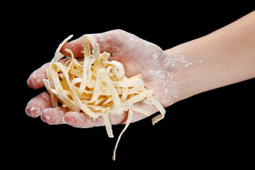 Raw fresh spaghetti isolated on black background