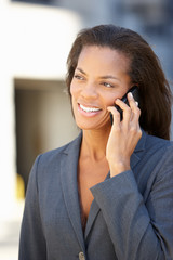 Businesswoman Outside Office On Mobile Phone