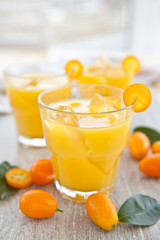 Fresh juice from oranges and kumquats