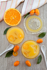 Fresh juice from oranges and kumquats