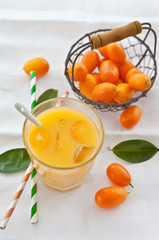 Fresh juice from oranges and kumquats