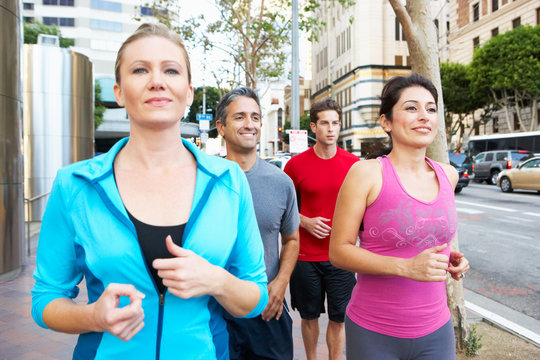 Group Of Runners On Urban Street