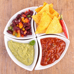 bowl of assortment of dips and tortilla chips