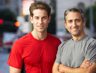 Portrait Of Two Male Runners On Urban Street