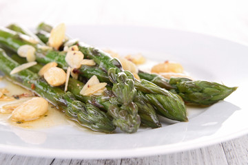 plate of asparagus with almonds