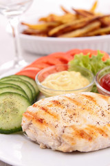 grilled meat with vegetables and fries