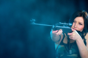 Beautiful woman holding weapon