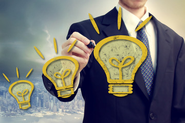 Businness Man with Idea Lightbulbs