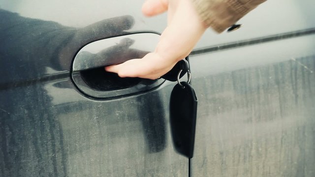 Man trying to unlock the car door