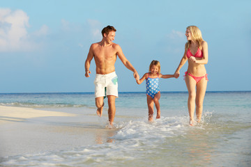 Fototapeta premium Family Having Fun In Sea On Beach Holiday