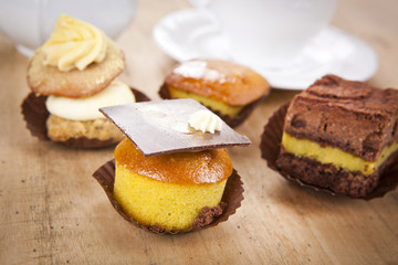 delicious cupcake pastry on wooden background table