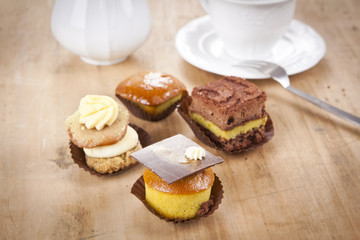 delicious cupcake pastry on wooden background table