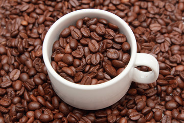 isolated cup of coffee with coffee bean inside