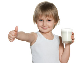 Cute little boy with a glass of milk
