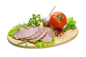 Ripe fresh ham with vegetables