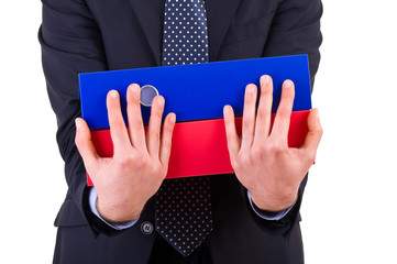 Businessman holding folders.