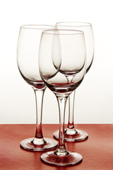 wine glasses on a colored background.