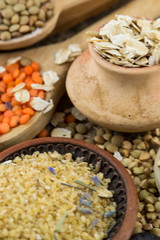 Wooden spoons with different kinds of groats