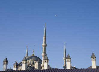Fototapeta na wymiar Blue Mosque roof with clear sky and moon.