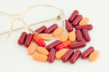 lots of pills on white background
