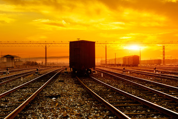 Fototapeta na wymiar reight train passing by on sunset beam